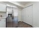 Stainless steel refrigerator with ice maker, white pantry, and wood-look floors at 480 S Seawynds Blvd, Gilbert, AZ 85233