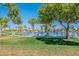 Scenic lakeside view with seating and lush landscaping, creating a serene atmosphere at 480 S Seawynds Blvd, Gilbert, AZ 85233