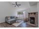 Spacious living room with brick fireplace, large window, and comfortable seating arrangement at 480 S Seawynds Blvd, Gilbert, AZ 85233