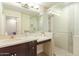 Modern bathroom features a glass-enclosed shower and sleek vanity with ample counter space at 4822 E Charleston Ave, Scottsdale, AZ 85254