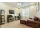Cozy office/bedroom with a leather chair, modern desk and shelving unit at 4822 E Charleston Ave, Scottsdale, AZ 85254