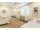 Spacious bedroom with playful decor, lots of natural light, and carpeted floor at 4822 E Charleston Ave, Scottsdale, AZ 85254