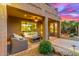 Covered patio featuring comfortable furniture and view of the backyard at 4822 E Charleston Ave, Scottsdale, AZ 85254