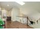 Second story hallway with hardwood floors and a skylight providing ample natural light at 4822 E Charleston Ave, Scottsdale, AZ 85254