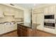 Spacious kitchen featuring a large island, stainless steel appliances, and white cabinets at 4822 E Charleston Ave, Scottsdale, AZ 85254