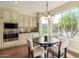 Bright eat-in kitchen with a large window, stainless appliances, and eat in table seating at 4822 E Charleston Ave, Scottsdale, AZ 85254
