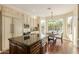 Spacious kitchen includes island with seating and stainless appliances and a view to the backyard at 4822 E Charleston Ave, Scottsdale, AZ 85254