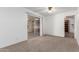 Bedroom with carpeting, natural light from sliding glass doors, and a ceiling fan at 5055 E Enid Ave, Mesa, AZ 85206