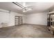This is a spacious garage with bright lighting, brick walls, and plenty of room for storage at 5055 E Enid Ave, Mesa, AZ 85206
