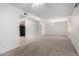 Open floor plan featuring plush carpeting, neutral walls, and doorways to other areas of the home at 5055 E Enid Ave, Mesa, AZ 85206