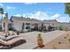 Paver patio with lounge chairs, desert landscaping, and outdoor dining area offer a serene backyard retreat at 526 W Kings Ave, Phoenix, AZ 85023