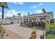 Private backyard featuring a large paver patio, lush plantings, and shaded dining area perfect for entertaining at 526 W Kings Ave, Phoenix, AZ 85023
