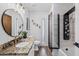 Modern bathroom with granite countertop, vessel sink, designer shower, and wood look floor tiles at 526 W Kings Ave, Phoenix, AZ 85023