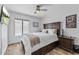 Cozy bedroom with wood-look floors and a ceiling fan, creating a relaxing and comfortable atmosphere at 526 W Kings Ave, Phoenix, AZ 85023