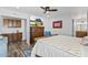 Comfortable bedroom with wood floors, TV, and easy access to the ensuite bathroom for added convenience at 526 W Kings Ave, Phoenix, AZ 85023