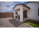 Covered patio with a table and chairs, and a large BBQ in the backyard at 5726 W Atlantis Way, Phoenix, AZ 85043