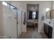 Bathroom with vanity and walk-in shower, open to the main bedroom at 5726 W Atlantis Way, Phoenix, AZ 85043