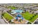 Community pool and playground area featuring an aquatic center, green space, and seating at 5726 W Atlantis Way, Phoenix, AZ 85043