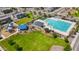 Aerial view of community pool, playground, and green space with seating and mature landscaping at 5726 W Atlantis Way, Phoenix, AZ 85043