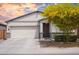 Charming single-story home with a two-car garage, desert landscaping, and inviting front entrance at 5726 W Atlantis Way, Phoenix, AZ 85043