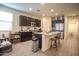 Spacious open-concept kitchen with an island, granite countertops and dark wood cabinetry at 5726 W Atlantis Way, Phoenix, AZ 85043