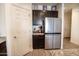 Stylish kitchen includes stainless steel refrigerator, granite counters, and custom wood cabinets at 5726 W Atlantis Way, Phoenix, AZ 85043