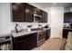 Well-equipped kitchen with gas range, microwave, and granite countertops in a modern design at 5726 W Atlantis Way, Phoenix, AZ 85043