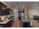 Modern kitchen features granite countertops, stainless steel appliances, and dark wood cabinetry at 5726 W Atlantis Way, Phoenix, AZ 85043