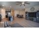 Open floor plan showing the living room with TV, dining area, and modern kitchen at 5726 W Atlantis Way, Phoenix, AZ 85043