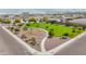 Community playground and green space with mature landscaping and views of the surrounding neighborhood at 5726 W Atlantis Way, Phoenix, AZ 85043