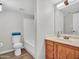 Bright bathroom featuring a vanity, toilet, and bathtub with shower at 5757 W Eugie Ave # 1076, Glendale, AZ 85304