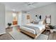 Bright bedroom features ensuite bathroom, ceiling fan, and natural light at 5757 W Eugie Ave # 1076, Glendale, AZ 85304