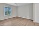 Bright bedroom featuring wood-look flooring and ample natural light at 5757 W Eugie Ave # 1076, Glendale, AZ 85304