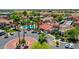 A sparkling community pool is surrounded by palm trees, lounge chairs, and well-maintained landscaping at 5757 W Eugie Ave # 1076, Glendale, AZ 85304
