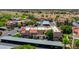 Aerial view shows condos with covered parking and green landscaping in a well-maintained community at 5757 W Eugie Ave # 1076, Glendale, AZ 85304