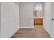 Hallway features vinyl floors, a bathroom vanity, and closet space at 5757 W Eugie Ave # 1076, Glendale, AZ 85304