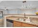 Well-lit kitchen featuring stone countertops and stainless steel appliances at 5757 W Eugie Ave # 1076, Glendale, AZ 85304