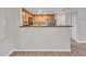Bright and airy living room featuring sleek wood floors, fresh paint, and a sliding glass door to the patio at 5757 W Eugie Ave # 1076, Glendale, AZ 85304