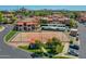 Community tennis court and clubhouse provide recreational opportunities for residents in the condominium complex at 5757 W Eugie Ave # 1076, Glendale, AZ 85304