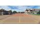 Well-maintained tennis court with net and fence, perfect for recreational activities on a sunny day at 5757 W Eugie Ave # 1076, Glendale, AZ 85304