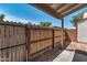 The backyard features a wooden fence and gravel at 6611 W Kingston Ln, Glendale, AZ 85306