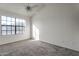 A sunlit bedroom features carpet and a large window at 6611 W Kingston Ln, Glendale, AZ 85306
