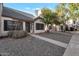 A front exterior view of home with desert landscaping and walkway at 6611 W Kingston Ln, Glendale, AZ 85306