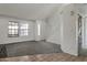 Bright living room with neutral walls and carpet flooring at 6611 W Kingston Ln, Glendale, AZ 85306