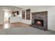 Living room features brick fireplace and tile flooring at 6611 W Kingston Ln, Glendale, AZ 85306