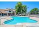 A community pool with lounge chairs and nearby tennis courts at 6611 W Kingston Ln, Glendale, AZ 85306