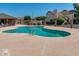 A community pool with nearby houses and mature landscaping at 6611 W Kingston Ln, Glendale, AZ 85306