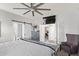 Bright main bedroom with ensuite, ceiling fan and tv at 6984 S Newport Ct, Chandler, AZ 85249