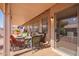 Covered patio with wicker furniture, neutral cushions, and a ceiling fan, perfect for outdoor entertaining at 6984 S Newport Ct, Chandler, AZ 85249