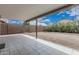 Backyard featuring a covered patio and privacy wall at 705 W Country Estates Ave, Gilbert, AZ 85233